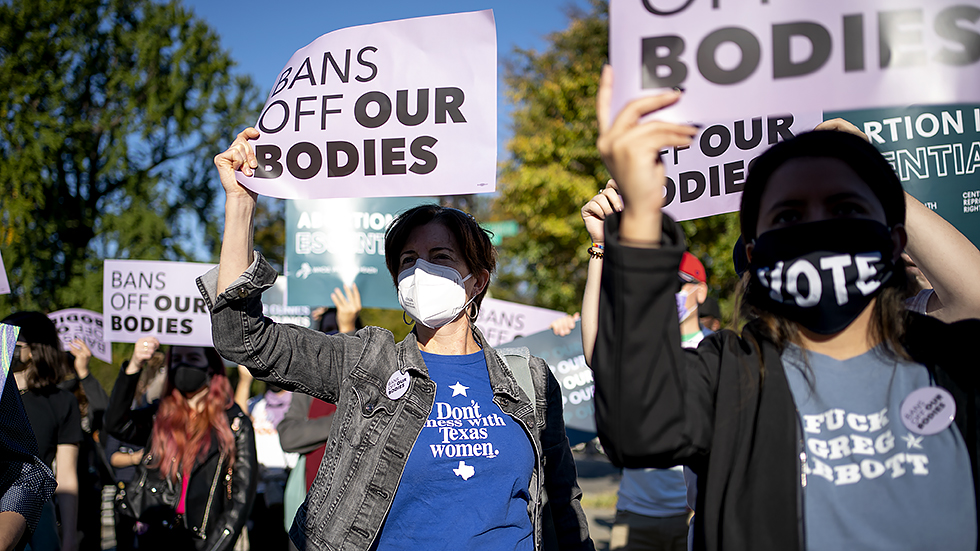 Pro-choice activists demonstrate outside the Supreme Court in Washington, D.C., Monday, November 11, 2021 as the court hears oral arguments for Whole Woman’s Health v. Jackson and United States v. Texas regarding the Texas abortion laws.