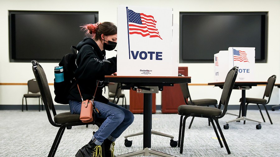 A George Mason University student votes in Fairfax, Va., on Tuesday, November 2, 2021.