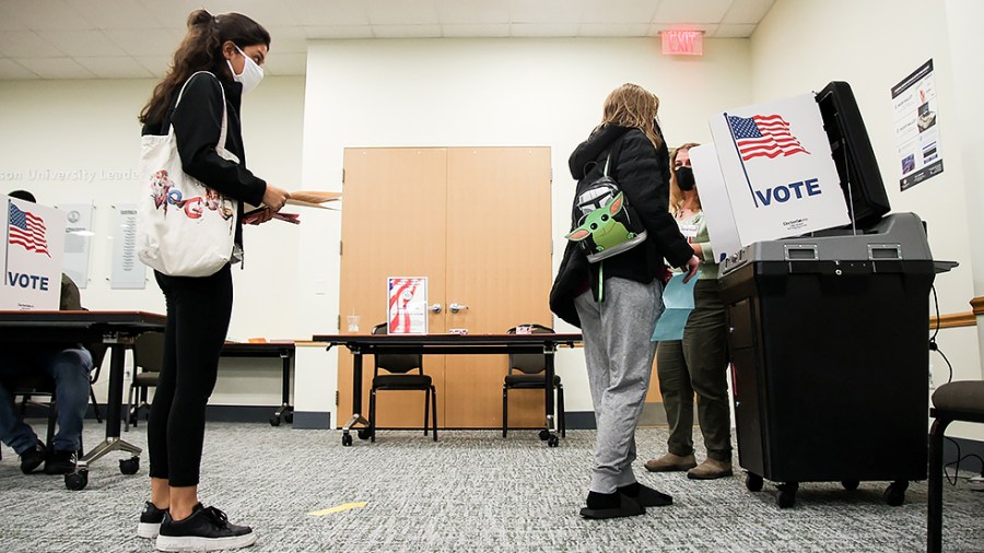 A George Mason University student votes in Fairfax, Va., on Tuesday, November 2, 2021.