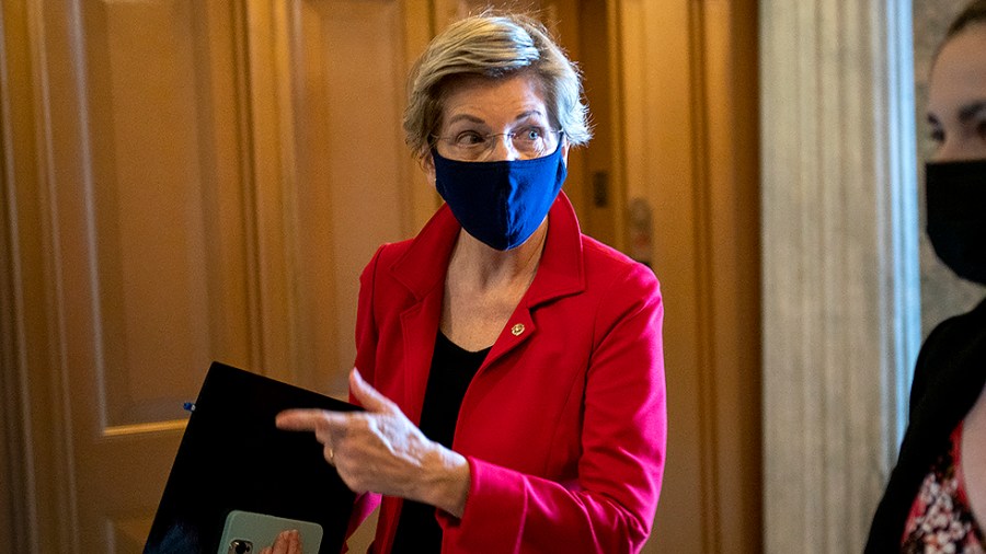 Sen. Elizabeth Warren (D-Mass.) arrives to the Senate Chamber for a series of judicial nomination votes on Tuesday, October 26, 2021.