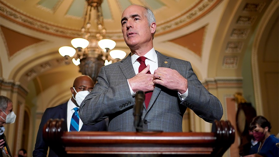 Sen. Robert Casey (D-Pa.) addresses reporters after the weekly policy luncheon on Tuesday, December 7, 2021.