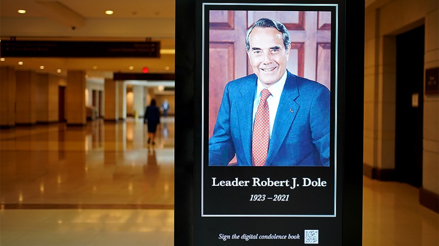 A photo of the late Sen. Bob Dole (R-Kan.) is seen in the Capitol Visitors Center on Wednesday, December 8, 2021 a day before Dole is to lie in state in the Capitol Rotunda.