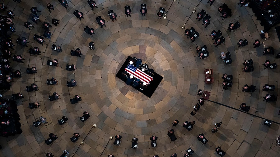 The casket of former Sen. Bob Dole, R-Kan., arrives in the Rotunda of the U.S. Capitol, where he will lie in state on Thursday, Dec. 9, 2021.