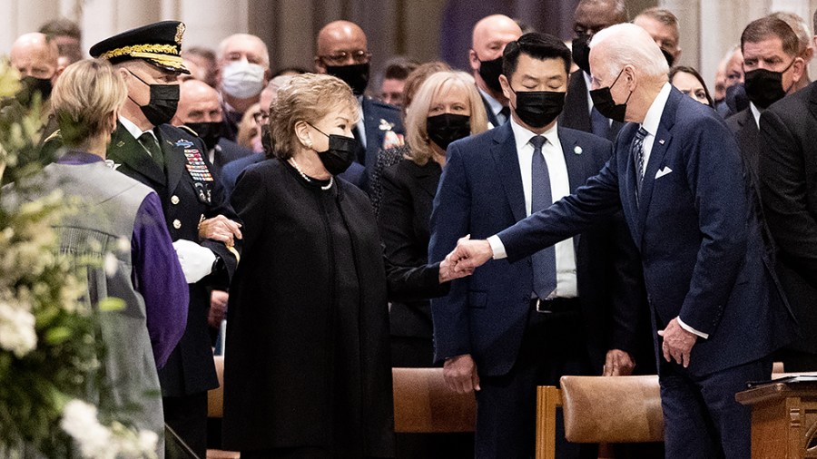 President Biden greets Elizabeth Dole prior to her husband Sen. Bob Dole's (R-Kan.) funeral at the Washington National Cathedral in Washington, D.C., on Friday, December 10, 2021.