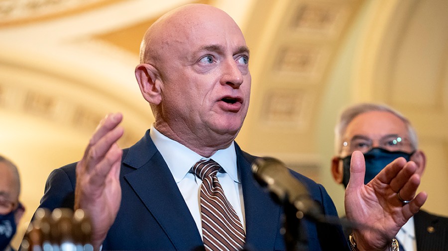 Sen. Mark Kelly (D-Ariz.) addresses reporters after the weekly policy luncheon on Tuesday, November 16, 2021.