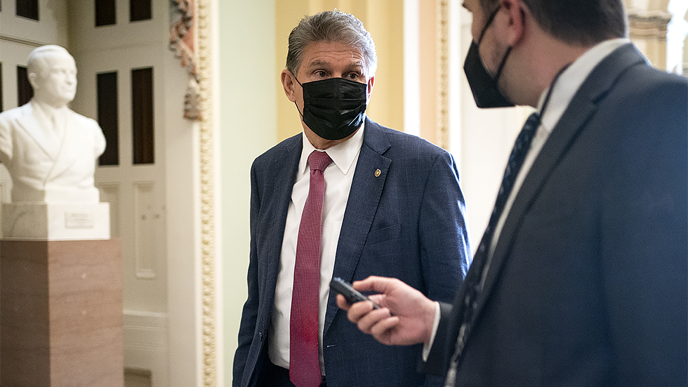 Sen. Joe Manchin (D-W.Va.) addresses reporters before the weekly Senate Democratic policy luncheon on Tuesday, December 7, 2021.