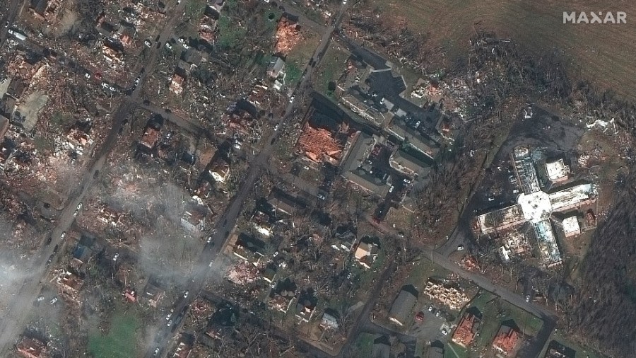 This satellite photo provided by Maxar shows homes and buildings in Mayfield, Ky., after a tornado caused heavy damage