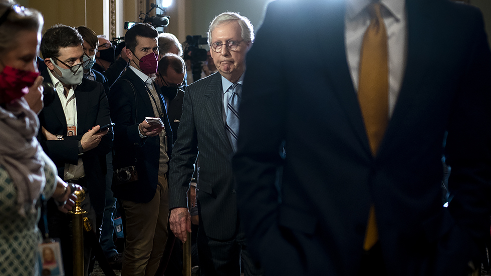 Senate Majority Leader Mitch McConnell (R-Ky.) returns to his office after the weekly policy luncheon on Tuesday, December 7, 2021.