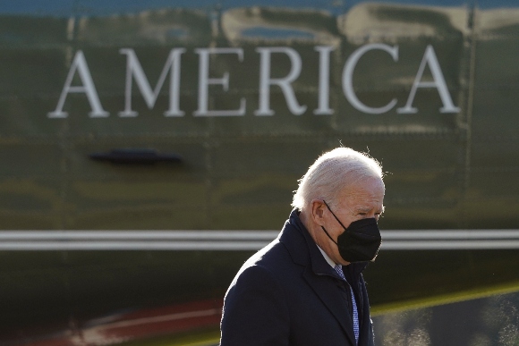 President Joe Biden walks to the Oval Office of the White House