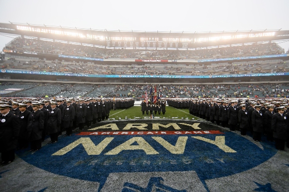 Navy midshipmen march before an NCAA college football game against Army