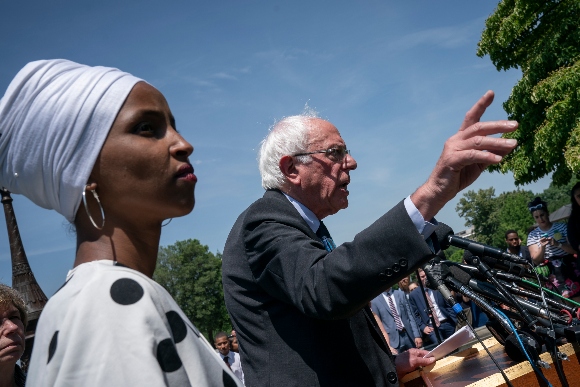 Sen. Bernie Sanders, I-Vt., center, joined at left by Rep. Ilhan Omar, D-Minn., announces legislation to cancel all student debt