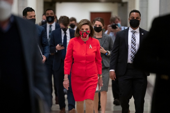 Speaker of the House Nancy Pelosi, D-Calif., arrives to meet with reporters at the Capitol