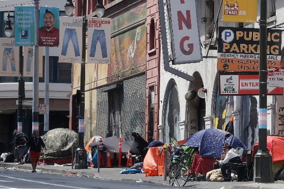 Tents line a sidewalk on Golden Gate Avenue in San Francisco