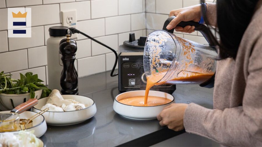 person pouring soup into a bowl