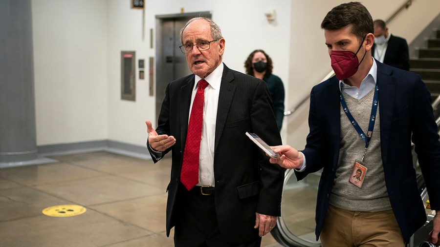 Sen. Jim Risch (R-Idaho) speaks to a reporter as he leaves the Capitol on Tuesday, December 7, 2021 for votes regarding nominations including Federal Communications Commission Chairman Jessica Rosenworcel.