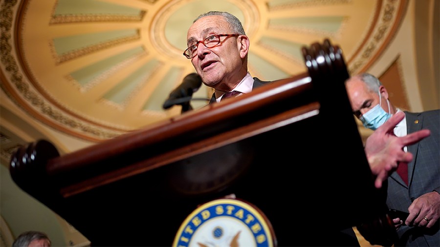 Majority Leader Charles Schumer (D-N.Y.) addresses reporters after the weekly policy luncheon on Tuesday, December 7, 2021.