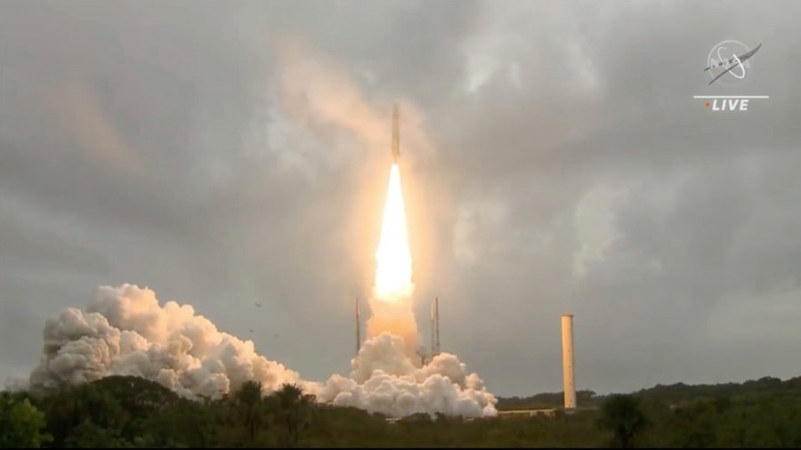 In this image released by NASA, Arianespace's Ariane 5 rocket with NASA's James Webb Space Telescope onboard, lifts off