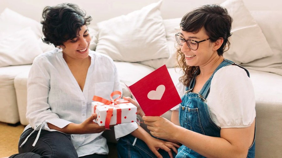 Two girls exchange Valentine's day presents