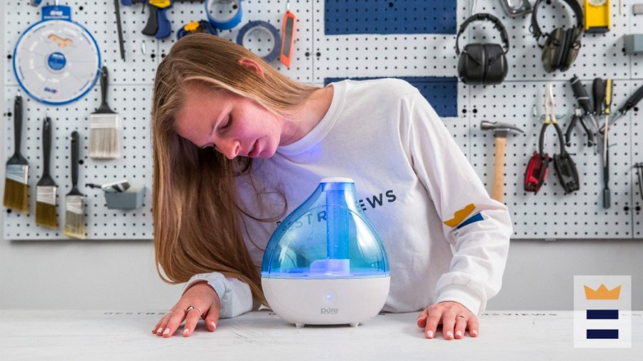 Woman in a workshop looking at a humidifier