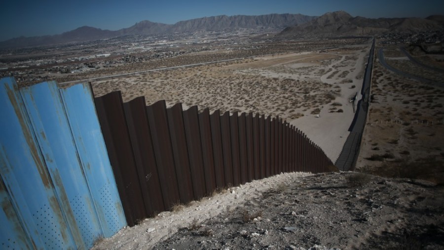 An older section of the border wall divides Ciudad Juarez, Mexico from Sunland Park, New Mexico