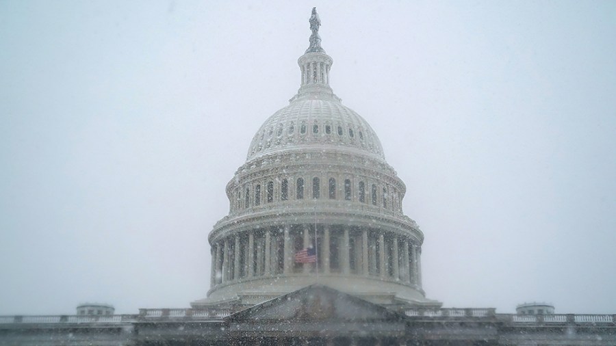 The U.S. Capitol is seen during a snow storm on Monday, January 3, 2022. The Washington, D.C., area is forecasted to receive five to six inches of snow before the afternoon.