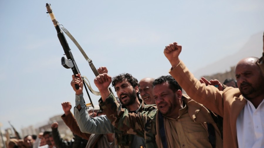 Armed Houthi fighters attend the funeral procession of Houthi rebel fighters who were killed in recent fighting with forces of Yemen's internationally recognized government