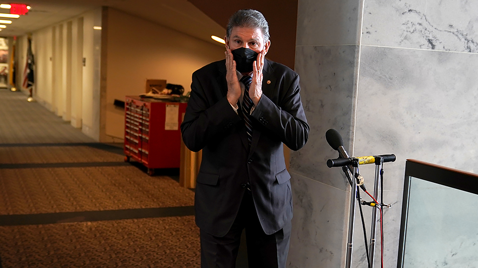 Sen. J Manchin (D-W.Va.) addresses reporters to discuss Covid-19 on Tuesday, January 4, 2022. He also took questions regarding Build Back Better and other legislative issues.