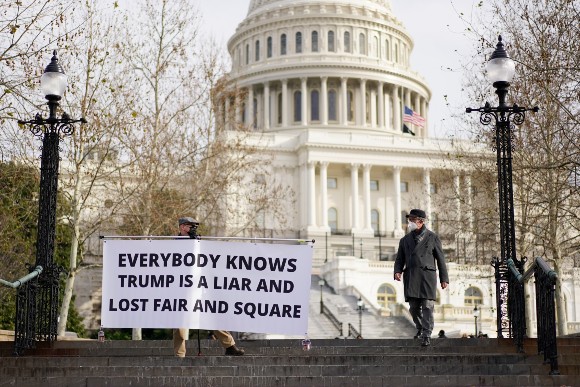 A sign at the Capitol says Trump loss