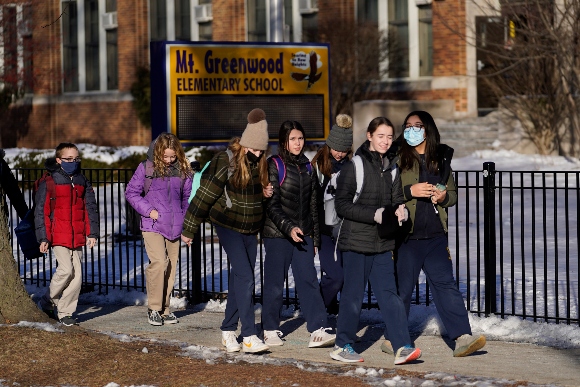 Students at the Mt. Greenwood Elementary School in Chicago depart after a full day of classes