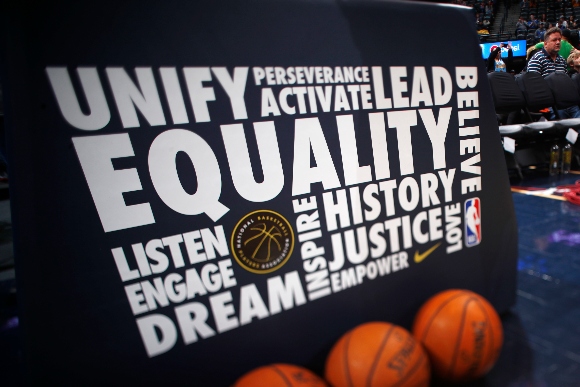 Black History Month logo on back of backboard in Pepsi Center