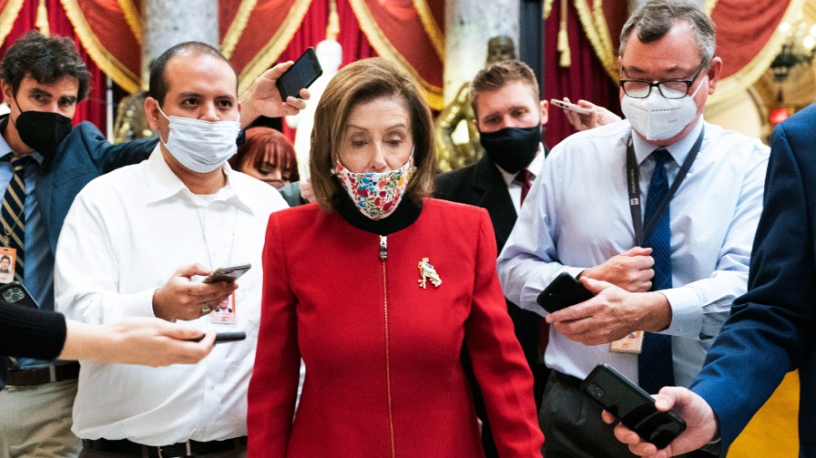 Speaker Nancy Pelosi (D-Calif.) walks back to her office from the National Statuary Hall in the Capitol