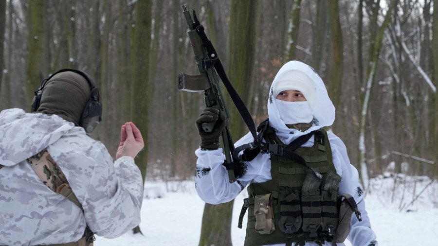 Members of Ukraine's Territorial Defense Forces train in a city park in Kyiv.