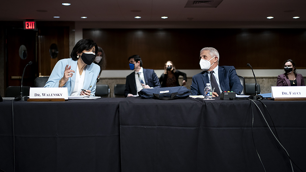 Dr. R Walensky, Director of the Centers for Disease Control and Prevention, speaks to Dr. A Fauci, White House Chief Medical Advisor and Director of the NIAID, before a Senate Health, Education, Labor, and Pensions Committee hearing on Jan.11