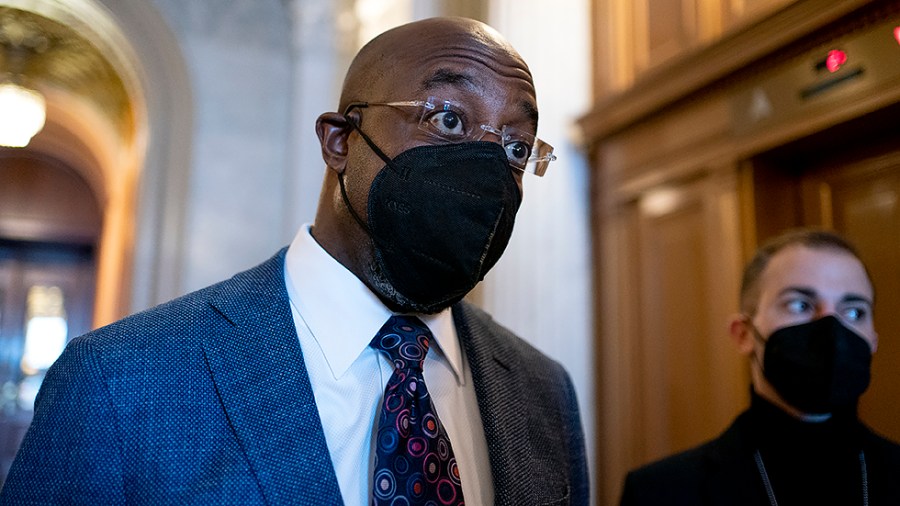 Sen. Raphael Warnock (D-Ga.) speaks to reporters following a nomination vote on Wednesday, January 5, 2022.