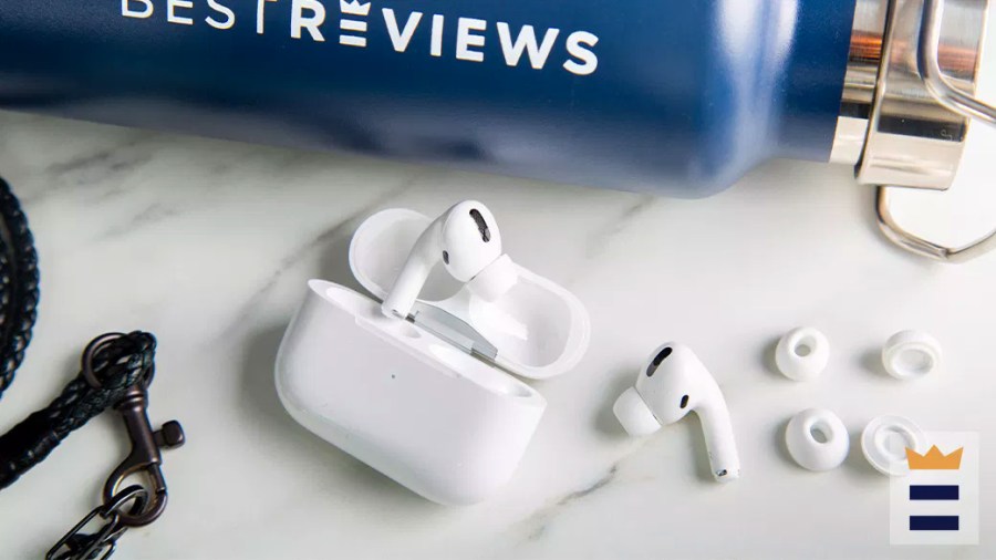 Pair of Apple Air Pods with case sitting on a counter