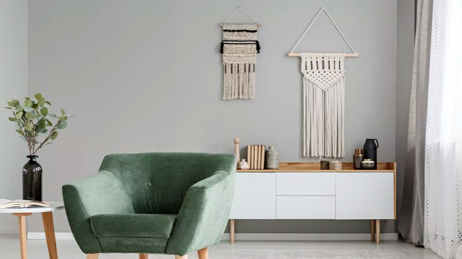 Living area decorated with retro furniture and macrame hangings