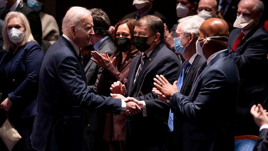 President Joe Biden shakes hands with Minority Leader Mitch McConnell (R-Ky.) after addressing the National Prayer Breakfast at the U.S. Capitol in Washington, D.C., on Thursday, February 3, 2022.