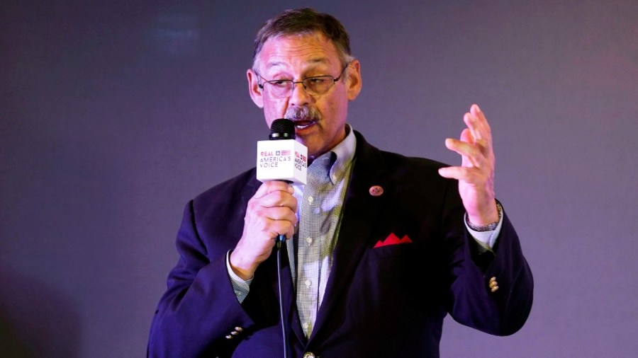 Rep. Mark Finchem, of Arizona, gestures as he speaks during an election rally in Richmond, Va.