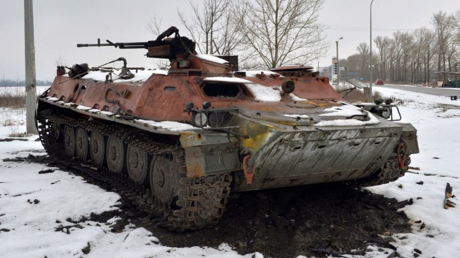 A destroyed Russian military vehicle is seen on the roadside on the outskirts of Kharkiv