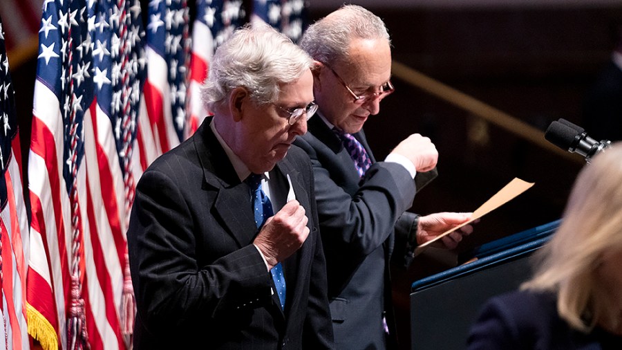 Minority Leader Mitch McConnell (R-Ky.) and Majority Leader Charles Schumer (D-N.Y.) arrive on stage to address at the National Prayer Breakfast at the U.S. Capitol in Washington, D.C., on Thursday, February 3, 2022.