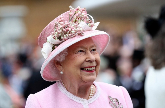 Britain's Queen Elizabeth arrives for a Royal Garden Party at Buckingham Palace