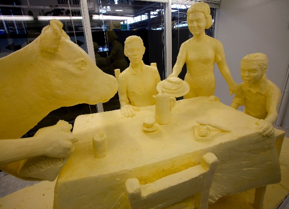 A sculpture made from nearly 1,000 pounds of butter that pays tribute to dairy farm families is displayed at the Pennsylvania Farm Show in Harrisburg, Pa.