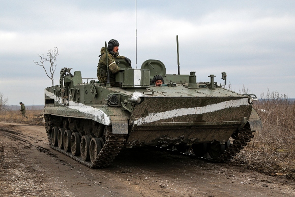 An armored vehicle rolls outside Mykolaivka, Donetsk region, the territory controlled by pro-Russian militants