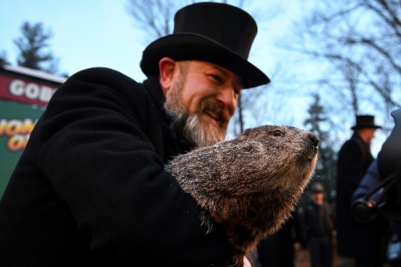 Groundhog Club handler A.J. Dereume holds Punxsutawney Phil