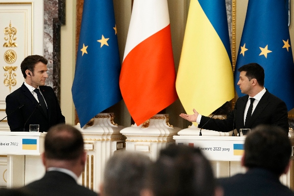 Ukrainian President Volodymyr Zelenskyy, right, gestures towards French President Emmanuel Macron during a joint press conference