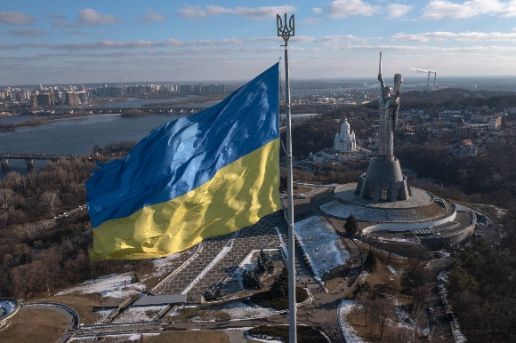 A view of Ukraine's national flag waves above the capital