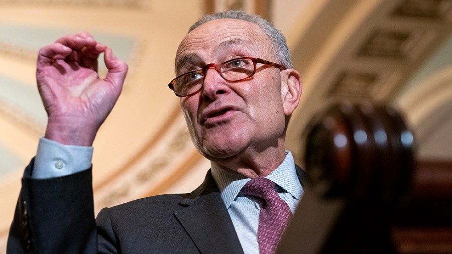 Majority Leader Charles Schumer (D-N.Y.) addresses reporters after the weekly policy luncheon on Tuesday, February 15, 2022.