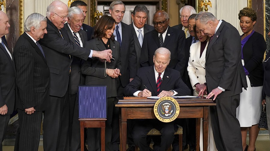 President Biden signs the Consolidated Appropriations Act in the Indian Treaty Room in the Eisenhower Executive Office Building at the White House complex in Washington, D.C., on Tuesday, March 15, 2022