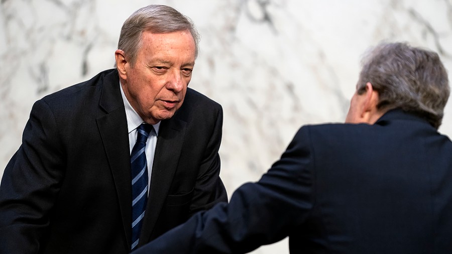 Sen. Richard Durbin (D-Ill.) speaks to Sen. John Kennedy (R-La.) during a Senate Judiciary Committee confirmation hearing of Supreme Court nominee Ketanji Brown Jackson on Monday, March 21, 2022.