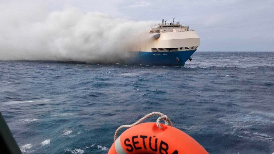 In this undated photo provided by the Portuguese Navy on Feb. 18, 2022, smoke billows from the burning Felicity Ace car transport ship